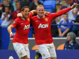 Los goleadores ''Chicharito'' (i) y Rooney se recuperaron de sus lesiones. MEXSPORT  /