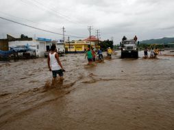 Tras el paso de la ahora tormenta tropical resultaron cuatro muertos y hay más de cuatro mil quinientos afectados en el Estado. AP  /