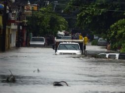 Debido al huracán 'Jova' los diez municipios del estado de Colima fueron declarados zona de emergencia. AFP  /