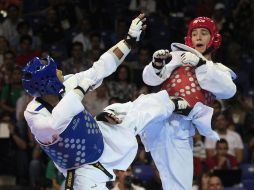 Damián Villa (rojo) durante un enfrentamiento en los Juegos Panamericanos 2011. AP  /