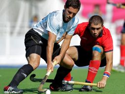 El jugador de Chile Raul Garces, y el argentino Agustin Mazzilli en la semifinal. AP  /