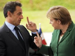 Sarkozy y Merkel han acordado una reunión para el miércoles por la tarde en Cannes. AFP  /