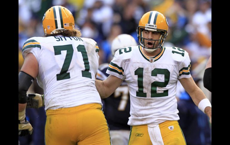 Aaron Rodgers lanza cuatro pases de anotación en el partido. REUTERS  /