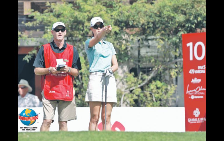 La golfista hawaiana Michelle Wie participó ayer el Pro-Am, y ya anunció que jugará libre de lesiones.  /