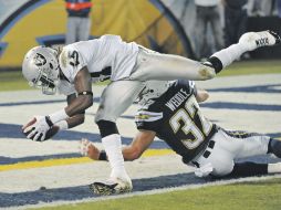 El receptor Denarius Moore consigue una de sus dos anotaciones de la noche. AP  /