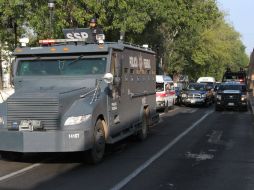 Elementos de seguridad resguardan la zona en la que ocurrió el posible saqueo. NOTIMEX  /