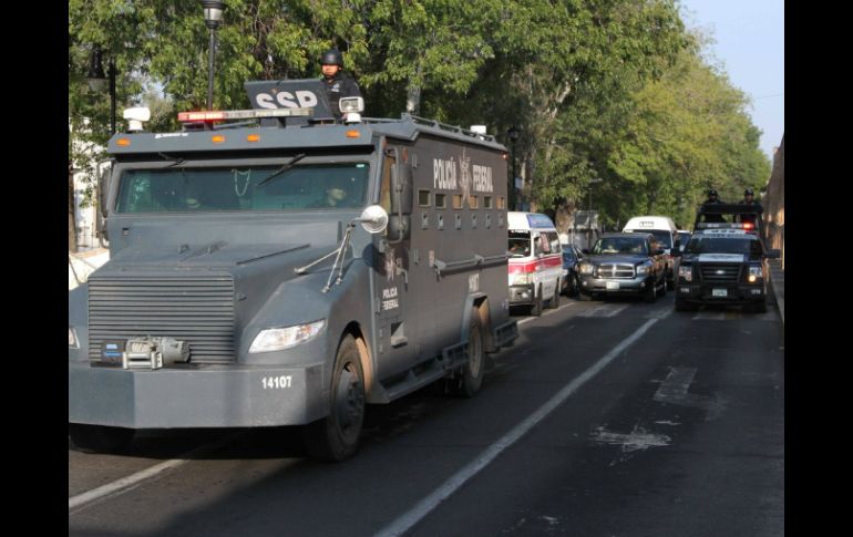 Elementos de seguridad resguardan la zona en la que ocurrió el posible saqueo. NOTIMEX  /