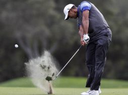 Woods aventaja en tres golpes a Matt Kuchary KJ Choi. AP  /