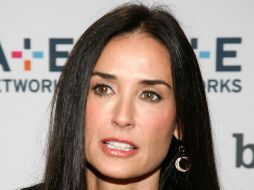 Cambiar la compañía de su esposo, por la compañía de tres perros Chihuahua ha sido la decisión de Demi Moore tras su divorcio. AFP  /