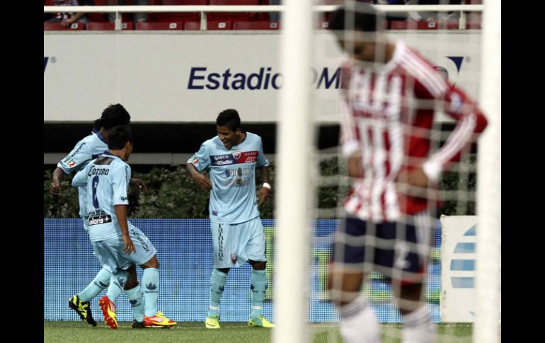 Los jugadores del Atlante celebrán el gol con el que vencieron al Guadalajara. MEXSPORT  /