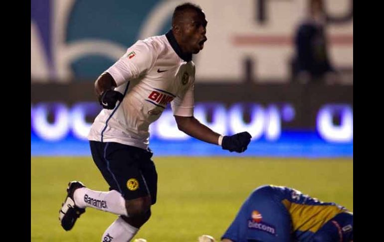 Christian Benítez celebra uno de sus dos tantos. AFP  /