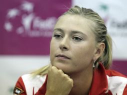 Sharapova reanudó hoy los entrenamientos tras regresar la víspera a su patria natal. EFE  /