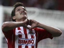 Carlos Fierro celebra su primer gol como profesional con el Guadalajara. MEXSPORT  /