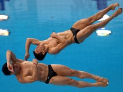 Para ganar la plata sumaron un total de 427.38 puntos y sólo fueron superados por la pareja china. AFP  /