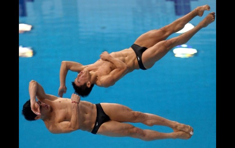 Para ganar la plata sumaron un total de 427.38 puntos y sólo fueron superados por la pareja china. AFP  /