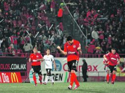 José Sand, autor del primer gol de los Xolos, celebra el triunfo sobre Atlas. MEXSPORT  /