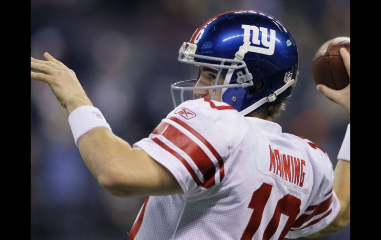 Eli Manning buscará la victoria en casa en el arranque de la temporada de la NFL ante Dallas. AP  /