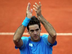 El jugador argentino Juan Martín Del Potro celebra su triunfo 6-2, 7-6 y 6-1 ante Karlovic. EFE  /