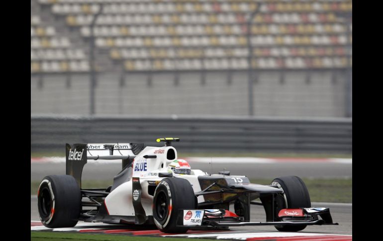 Los dos pilotos de Red Bull, el alemán Sebastian Vettel y el australiano Mark Webber, marcaron el tercer y el cuarto tiempo.AP  /