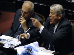 Diputados argentinos durante la sesión de discusión del proyecto de la ley oficialista. AFP  /