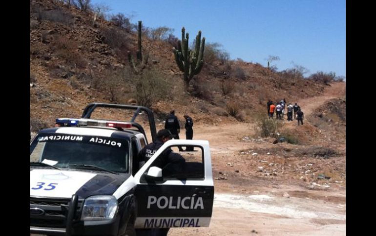 La policía asegura el área donde el cuerpo de Ávila García fue encontrado. AP  /