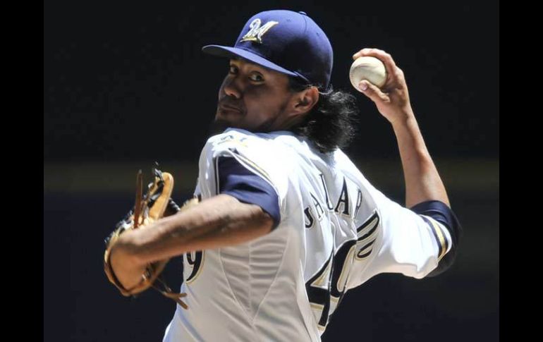 Yovani Gallardo supo controlar a los bateadores de San Diego para llevarse la victoria. AP  /