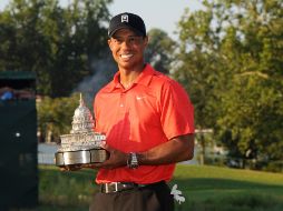 Woods se colocó en el primer lugar de la lista de ganancias de la Gira y en el sitio de honor de la FedEx Cup. AFP  /