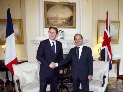 Los dos líderes se reunieron en la capital británica en el marco de la primera visita oficial de Hollande(d) al Reino Unido. AFP  /