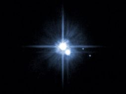 Imagen del Hubble que muestra la nueva luna encontrada en Plutón. AP  /