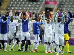 Jugadores de Honduras durante el festejo de su victoria ante España. ARCHIVO  /