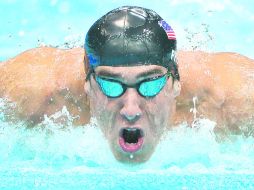 Por fin. Michael Phelps puede estar tranquilo, tras conseguir la hazaña. AP  /