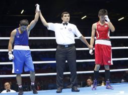 El momento en que le dan el triunfo a Magomed Abdulhamidov (izq), ante la incredulidad del nipón (der). REUTERS  /