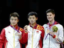 El podio del tenis de mesa individual de Londres 2012, ocupado por dos chinos y un alemán. REUTERS  /