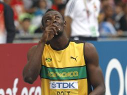 Bolt busca mantener su título ante su joven compañero Yohan Blake. AFP  /