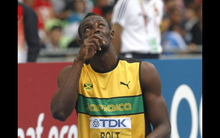 Bolt busca mantener su título ante su joven compañero Yohan Blake. AFP  /