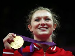 La gimnasta dorada mejora su séptimo puesto en Beijing. REUTERS  /