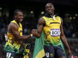 Blake (izq) y Bolt (der) reeditarán su disputa por el oro en los 200 metros, cuyas eliminatorias arrancan este martes. REUTERS  /