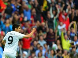 Oribe Peralta festeja el gol del triunfo del cuadro mexicano ante Japón. AFP  /