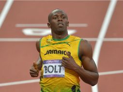 Bolt ganó su semifinal con un tiempo de 20.18. XINHUA  /