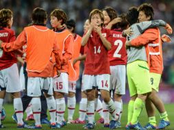 Las japonesas reaccionan tras perder la final de futbol femenil ante Estados Unidos. EFE  /