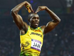 El atleta jamaiquino  celebra luego de ganar la prueba de relevos 4x100 metros en los Juegos Olímpicos de 2012. EFE  /