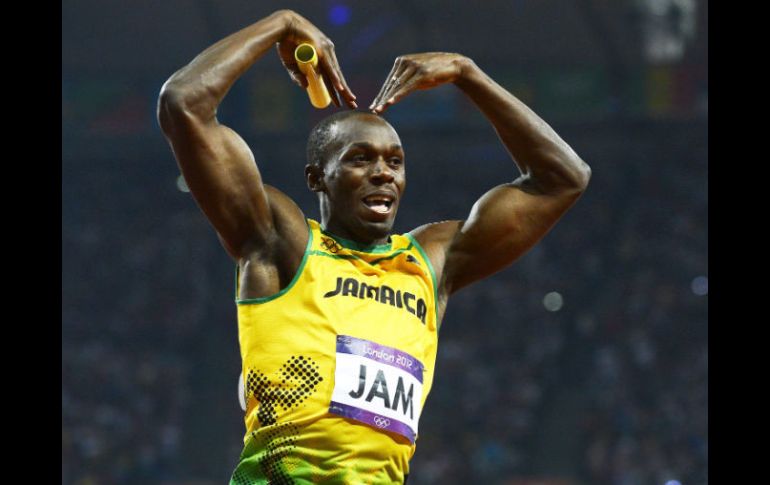 El atleta jamaiquino  celebra luego de ganar la prueba de relevos 4x100 metros en los Juegos Olímpicos de 2012. EFE  /