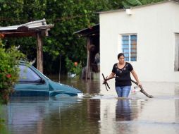 Al menos cinco muertos, más de 100 viviendas dañadas y 37 vehículos siniestrados dejó la tormenta tropical ''Ernesto''. ARCHIVO  /