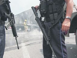 Patrullaje. Elementos de la Policía Federal custodian la Carretera a Chapala. AFP  /