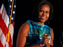 Sonriente y jovial, la señora Obama fue invitada de honor a dos caucus. REUTERS  /