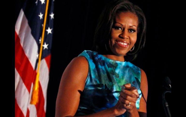 Sonriente y jovial, la señora Obama fue invitada de honor a dos caucus. REUTERS  /