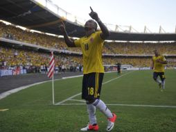 Juan Camilo Zúñiga del equipo colombiano celebra su anotación ante Uruguay. AFP  /