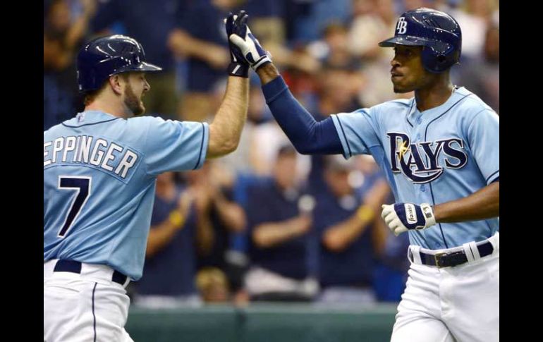 B.J. Upton (der) fue la pieza clave de la victoria de Tampa Bay. AP  /