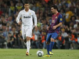 Wayne Rooney dijo que le gustaba Ronaldo (i), pero que el juego de Messi (d) era espectacular. ARCHIVO  /