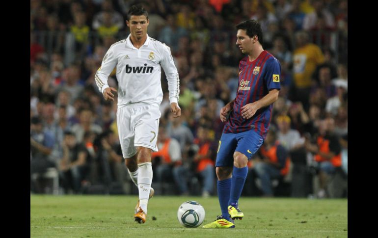 Wayne Rooney dijo que le gustaba Ronaldo (i), pero que el juego de Messi (d) era espectacular. ARCHIVO  /